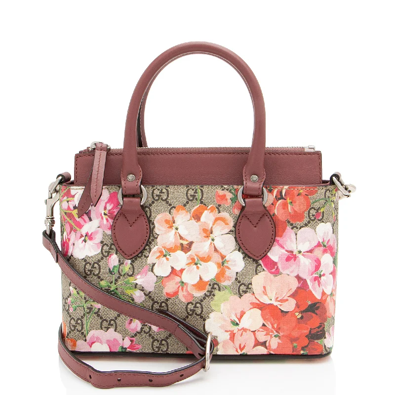 Faux Fur - Trimmed Tote Bag in White for a Cozy Winter LookMetallic Tote Bag in Rose Gold with Chain Handles for a Glamorous Night OutGucci GG Supreme Blooms Mini Zip Tote