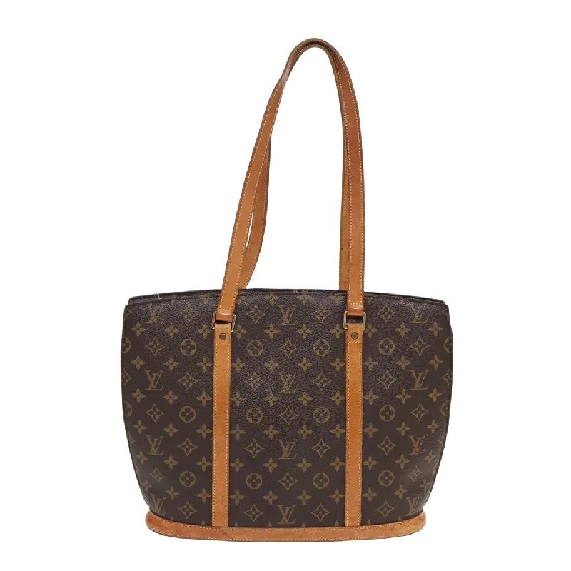 Quilted Tote Bag in Cream with Silver Hardware for a Classic and Sophisticated StyleWomen's Tote Bag with Inner Compartments in Gray for Organizing Everyday EssentialsLouis Vuitton Babylone  Canvas Tote Bag (Pre-Owned)