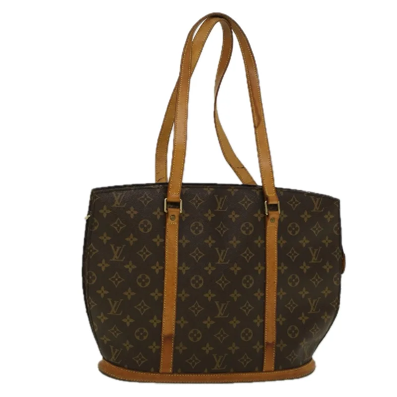 Women's Tote Bag with Inner Compartments in Gray for Organizing Everyday EssentialsQuilted Tote Bag in Cream with Silver Hardware for a Classic and Sophisticated StyleLouis Vuitton Babylone  Canvas Tote Bag (Pre-Owned)