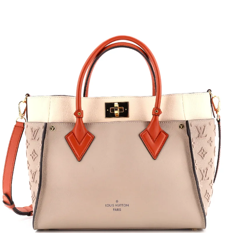 Quilted Tote Bag in Cream with Silver Hardware for a Classic and Sophisticated StyleLinen Tote Bag in Natural Beige with Braided Details for a Rustic Summer EnsembleOn My Side Tote Monogram Tuffetage Leather MM