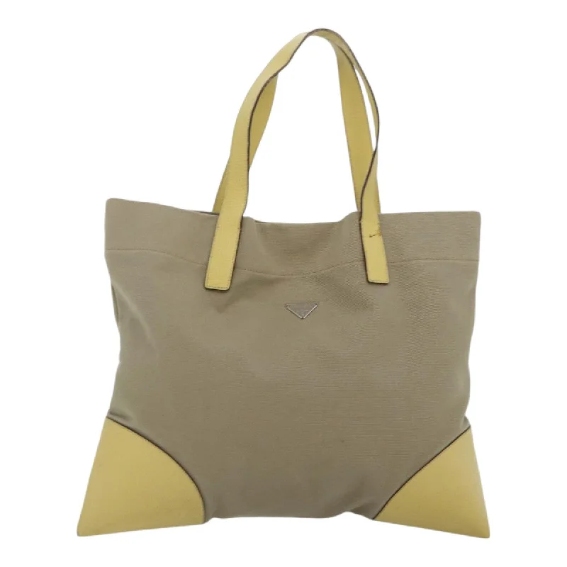 Patchwork Tote Bag in Denim with Vintage - Inspired Designs for a Retro AppealFaux Fur - Trimmed Tote Bag in White for a Cozy Winter LookPrada  Canvas Tote Bag (Pre-Owned)