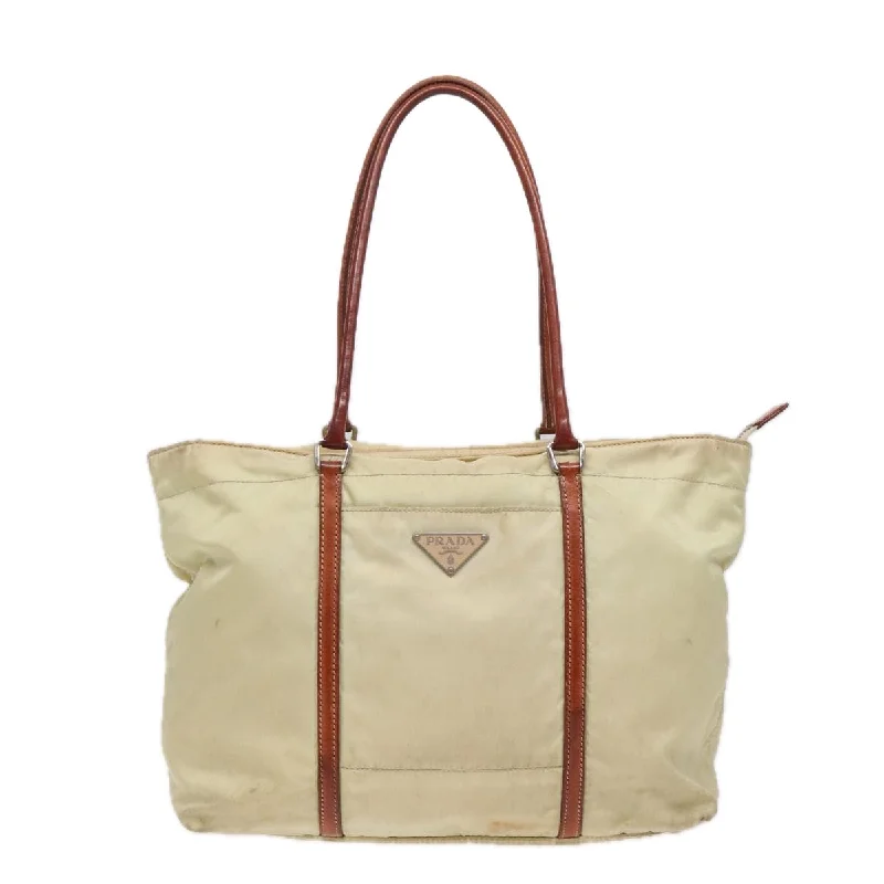 Linen Tote Bag in Natural Beige with Braided Details for a Rustic Summer EnsembleMonogrammed Tote Bag in Brown Leather with Personalized Initials for a Custom and Elegant TouchPrada Tessuto  Synthetic Tote Bag (Pre-Owned)