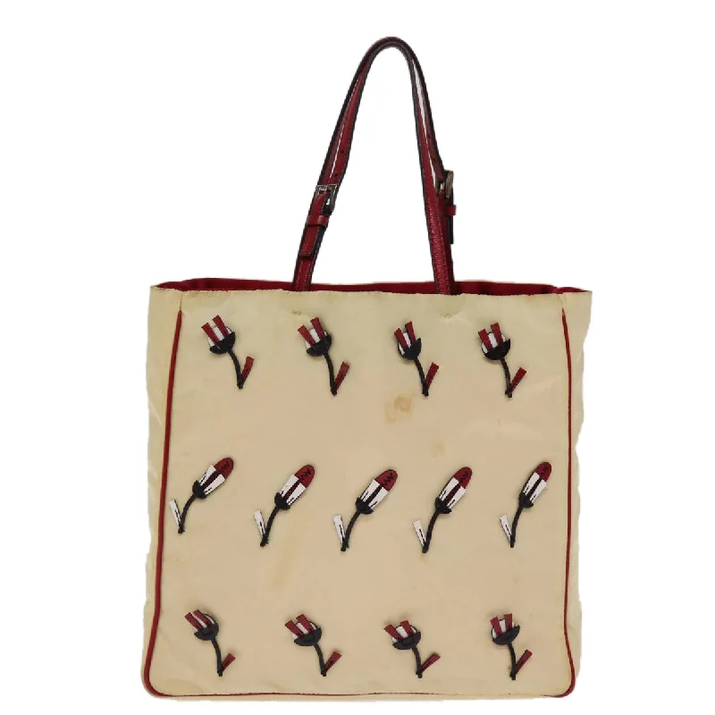 Patchwork Tote Bag in Denim with Vintage - Inspired Designs for a Retro AppealQuilted Tote Bag in Cream with Silver Hardware for a Classic and Sophisticated StylePrada Tessuto  Synthetic Tote Bag (Pre-Owned)