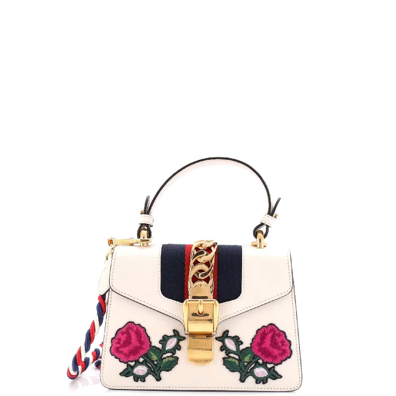 Printed Silk Shoulder Bag in Red for a Pop of ColorSylvie Top Handle Bag Embroidered Leather Mini